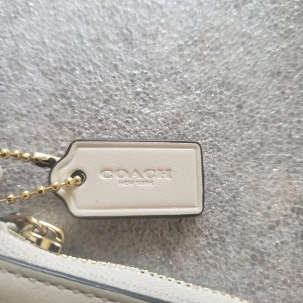 Coach White Leather Wristlet with Cut Out Tea Rose